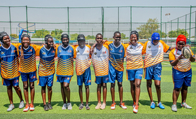Female Rugby Team poses for a picture at Dr. Biar Sport complex