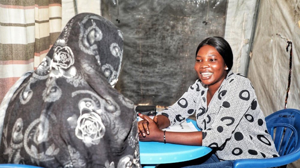  A survivor being attended to by a case manager at women and girls friendly space
