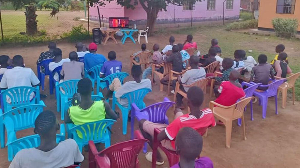 Photos taken at Torit youth Centre during a movie session.