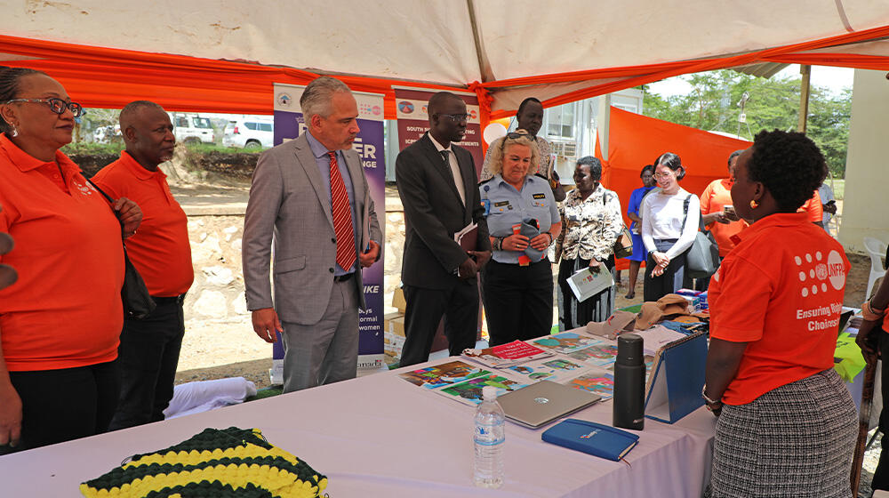 Chairperson of South Sudan National Bureau of Statistics, Augustino Ting Mayai,and other guests listening to  Men4Women’s  Euice Pikyiko during the event 