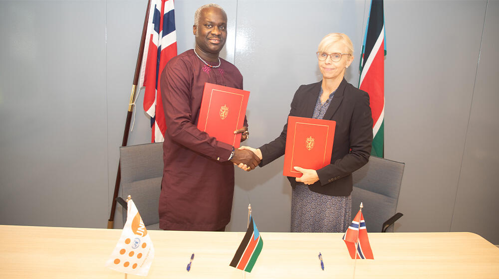 H.E Linken Lymann Berrymann and UNFPA Representative Dr. Ademola Olajide after the signing