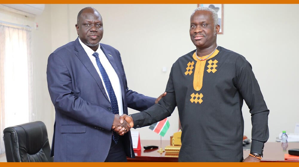 Hon. Peter Gatwech Kulang & Dr. Ademola Olajide shake hands after the meeting 
