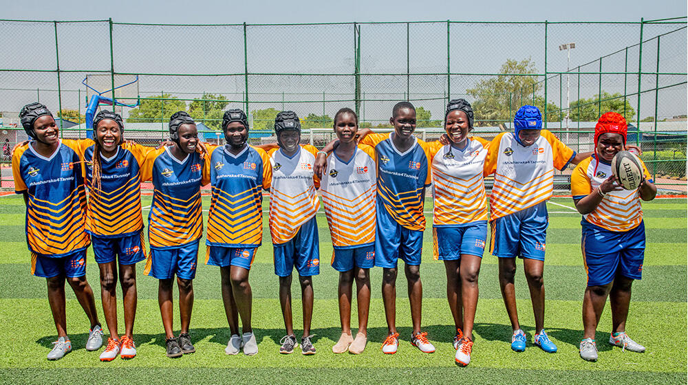 Female Rugby Team poses for a picture at Dr. Biar Sport complex