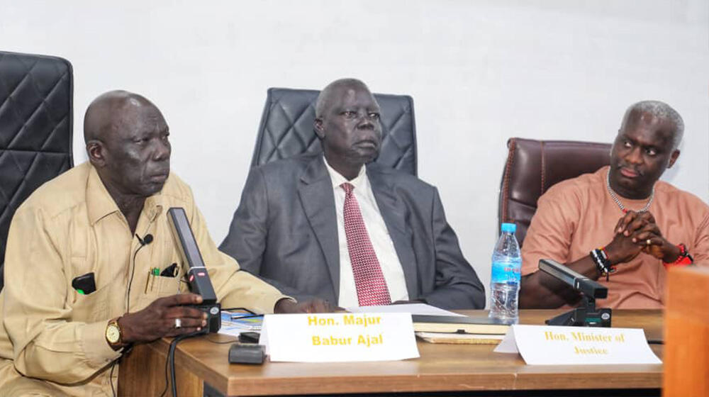 Hon. Majur Babur Ajal addressing parliamentarians as Hon Ruben Madol Arol and Dr. Ademola Olajide listens